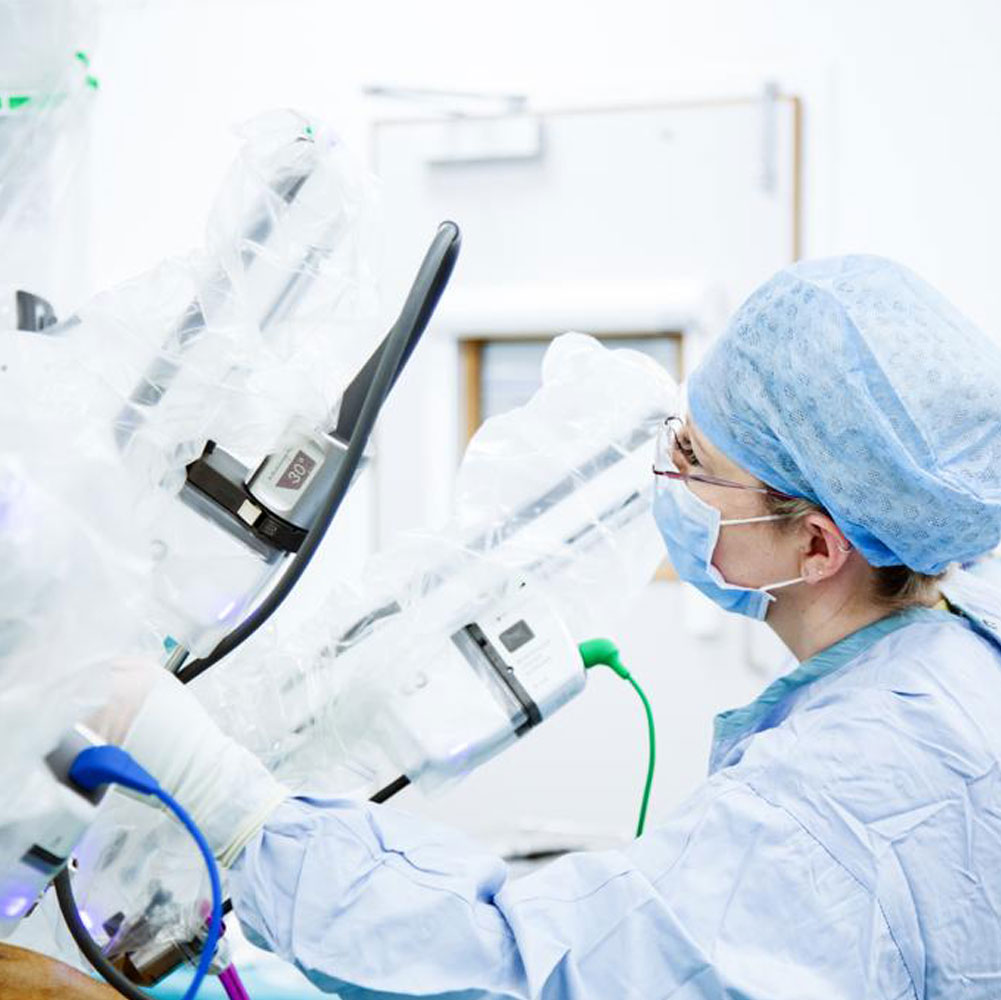 A surgical assistant at a robotic surgical system.