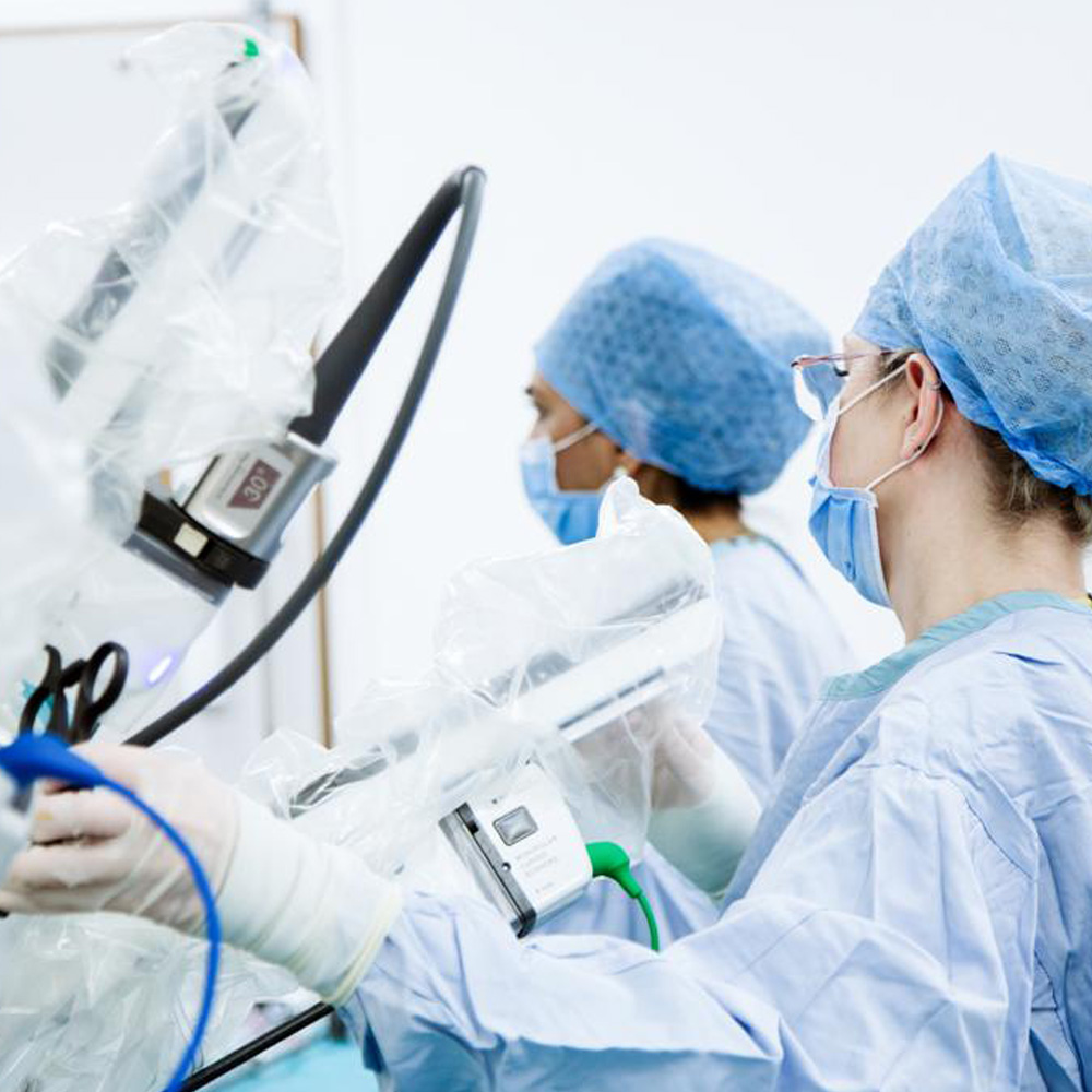 Surgical assistants working with a robotic surgical system.